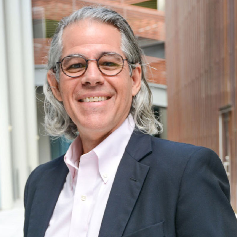 Professional portrait of Jimmie Lenz wearing glasses