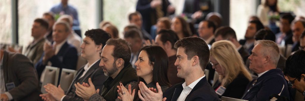 Audience members applauding during a Digital Assets at Duke conference session